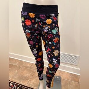 Disney Women’s Coco Multicolored Leggings with Stripes on side, size medium